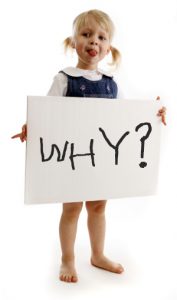 Picture of girl holding a sign that says why?